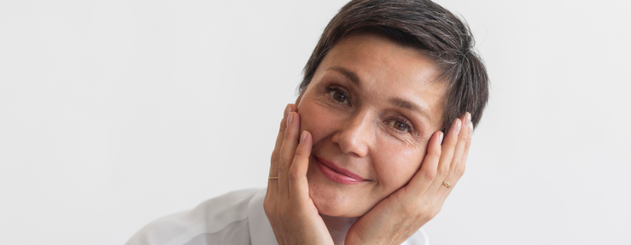 Satisfied woman with healthy, glowing skin.