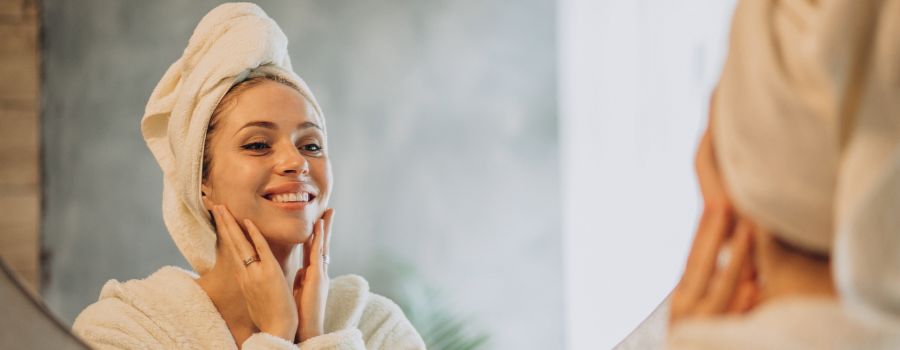 Satisfied woman with healthy, glowing skin.
