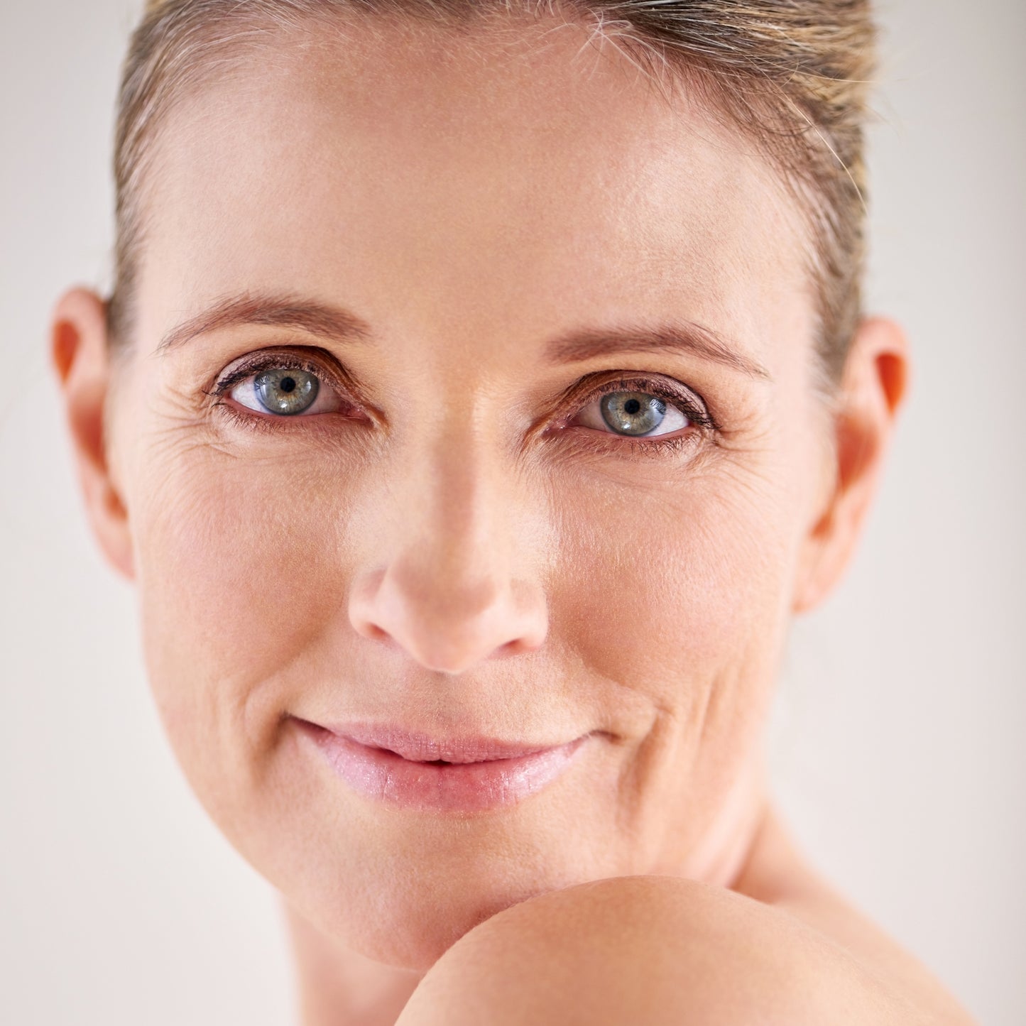 Close-up of a woman's face, showcasing healthy, smooth skin.
