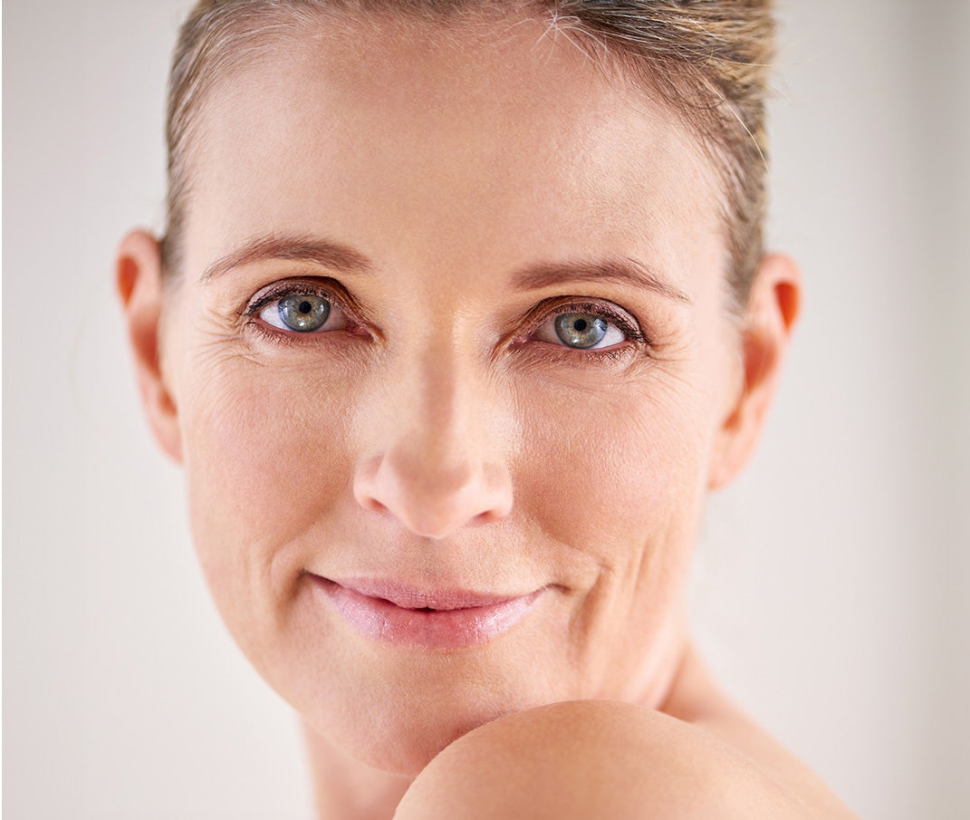 Close-up of a woman's face, showcasing healthy, radiant skin.