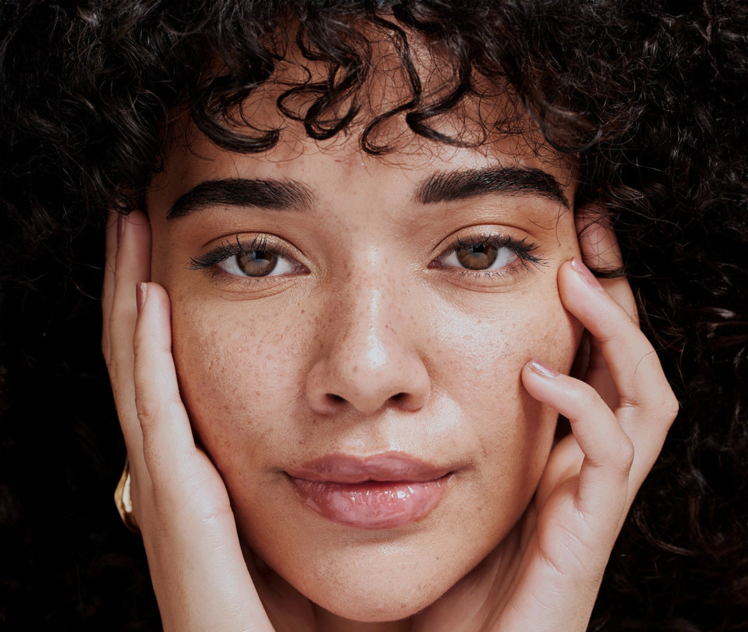 Close-up of a woman's face, showcasing healthy, radiant skin.