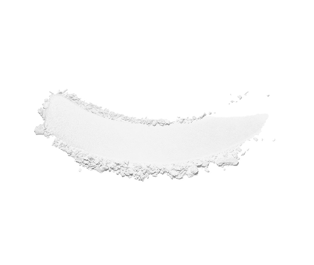 Swiped sample of white mineral sunscreen powder
