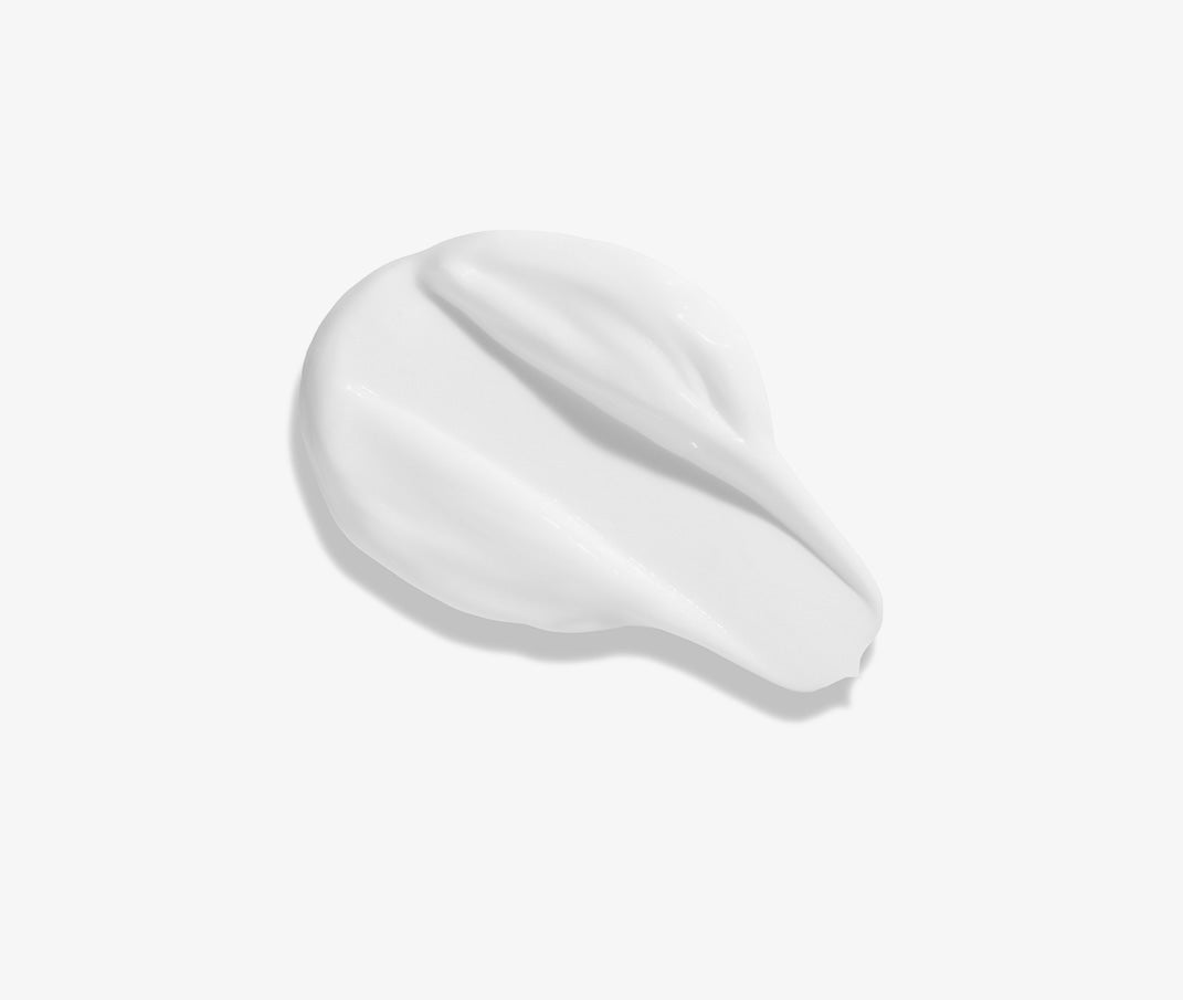 Creamy white balm swatch, smooth texture.