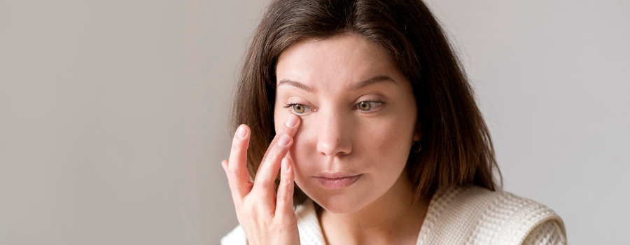 Satisfied woman with healthy, glowing skin.
