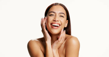 Best vitamin C serum recommended by dermatologist concept featuring a smiling man with healthy-looking skin against a blue background.