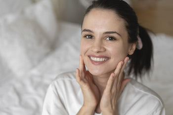 Woman with glowing skin after using the best at-home chemical peel for smoother-looking texture and brighter-looking complexion.