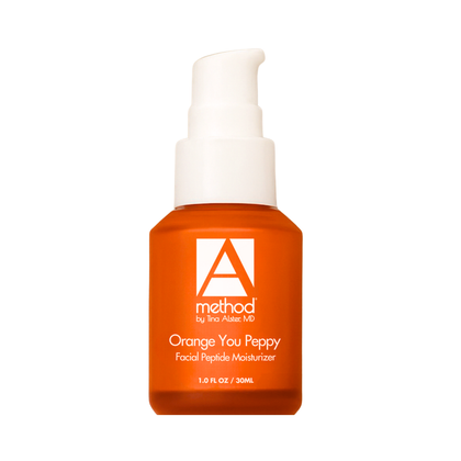 Orange glass bottle on white background