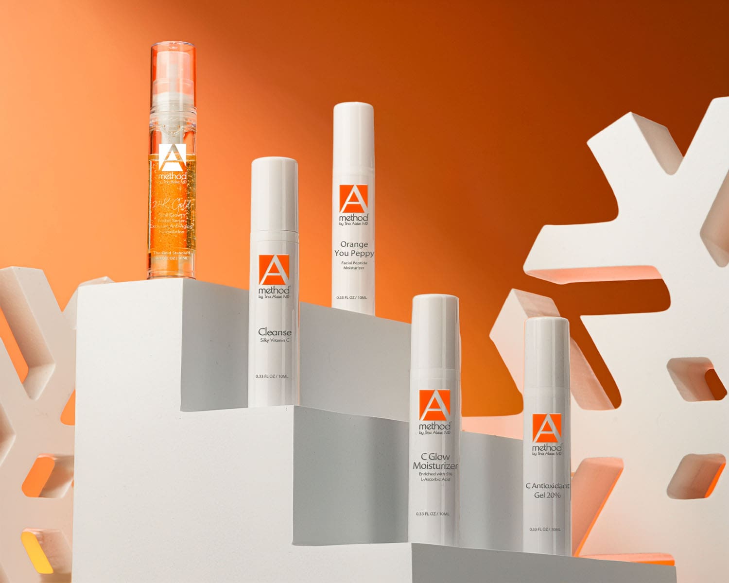 Mini skincare serums and moisturizers arranged on white blocks with festive snowflake accents, offered as holiday stocking stuffers.